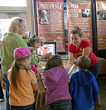 Visitors to the North Carolina Language and Life Project booth at the state fair