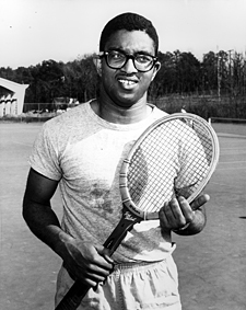 Irwin Holmes with tennis racquet