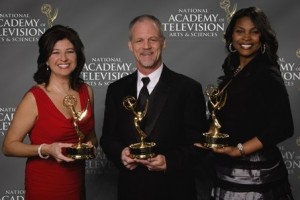 Winners holding their Emmy Awards.