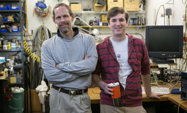 Dean Verhoeven (left) and Logan Maxwell (right). Maxwell began tinkering with ideas for the Temperfect mug (in his hand) as an undergrad at NC State.