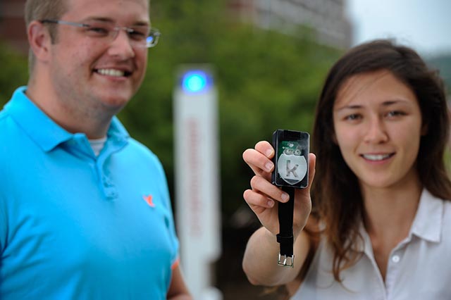 Student Bradford Ingersoll (left) and recent grad Tia Simpson (right) show off the Konnect, a one-button emergency notification system they built.