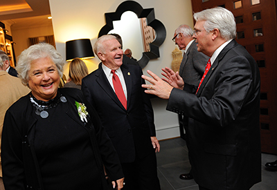 Chancellor Randy Woodson, left, meets with donors Bill and Marsha Prestage at the chancellor's residence. 