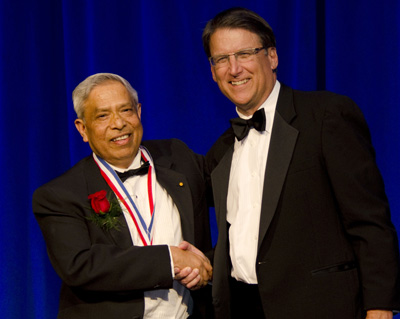 Jay Narayan (at left) and Governor Pat McCrory at the North Carolina Award ceremony Nov. 13.