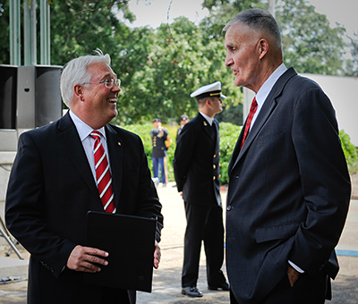 Gen. Hugh Shelton, former Chairman of the Joint Chiefs of Staff, talks with Chancellor Randy Woodson, left, at a campus event.