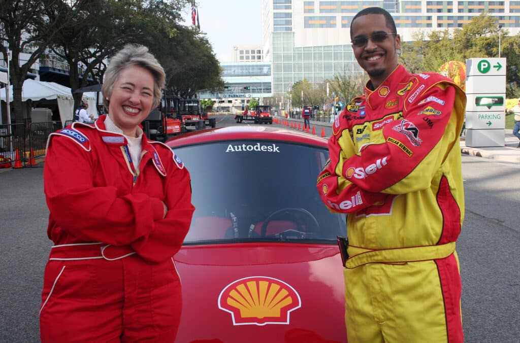 Coleman with Houston mayor posing next to his concept car.