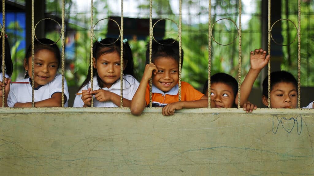 A group of children outside the school.