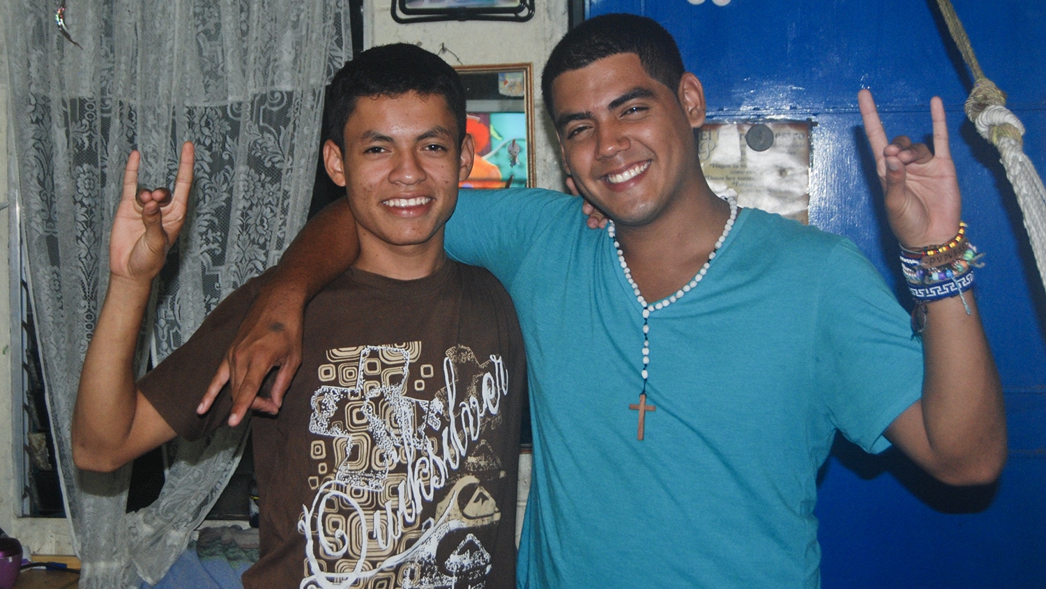 Saul Flores (right) meets his brother Sergio in San Salvador.