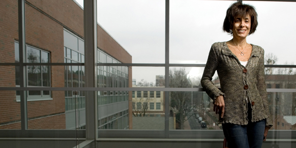 Marie Davidian at window of SAS Hall.