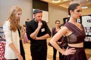 Student designer Sarah Cannon (left) and faculty advisor Justin LeBlanc (center) inspect a dress at Art2Wear.
