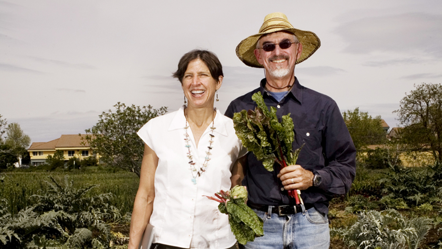 Authors standing in field.