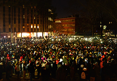 More than 3,000 people turn out against a bitter wind to honor three slain students.