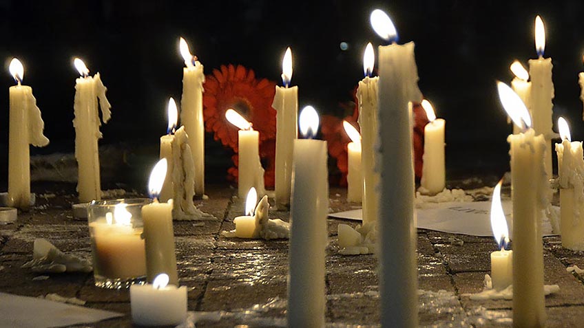 Candles at a vigil for shooting victims in Chapel Hill.