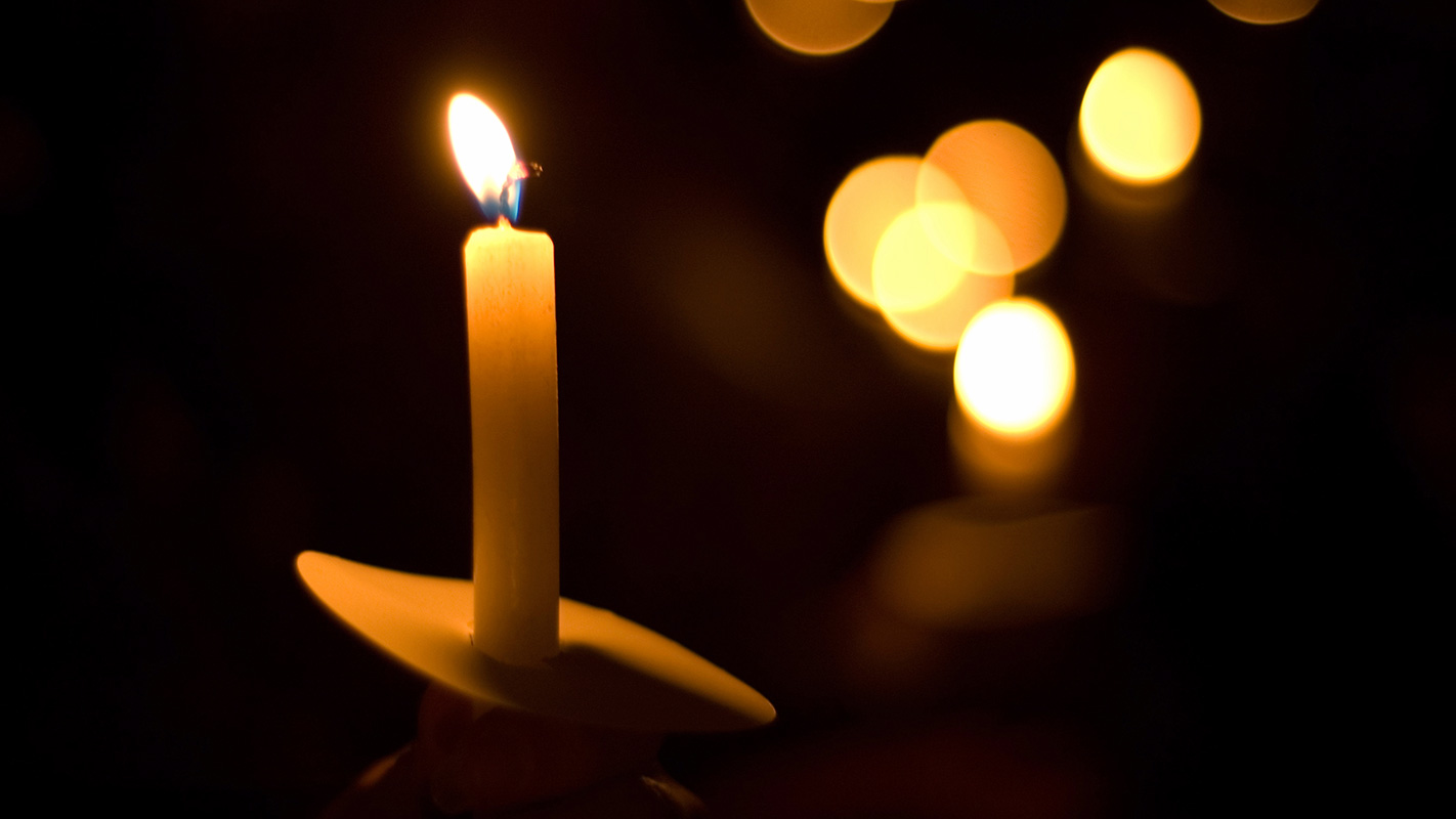 Candles burning at a vigil.