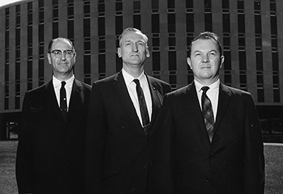 Professor William Block, right, with unidentified faculty senators on the Brickyard in the 1960s.