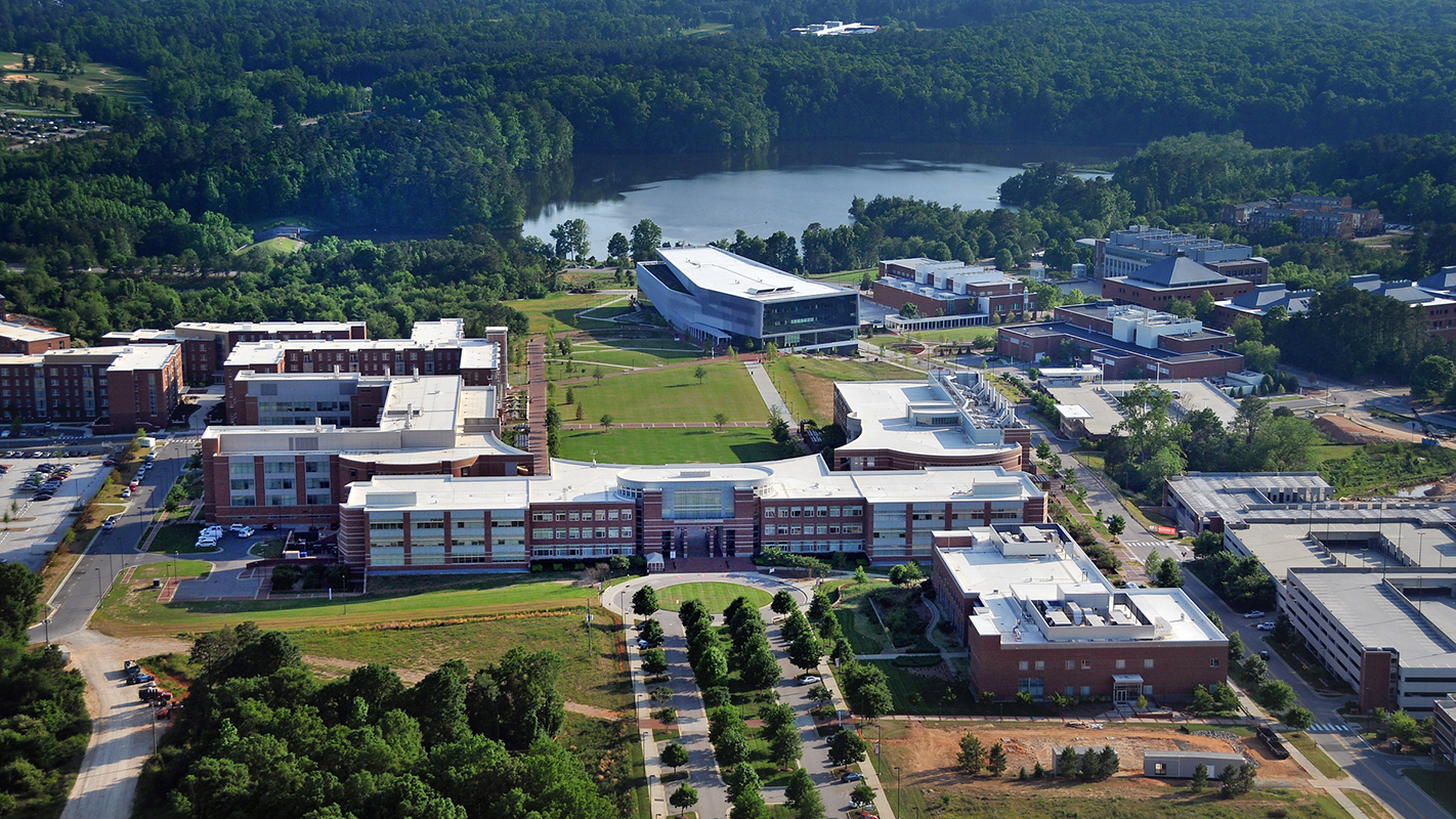 An aerial shot of the Hunt Library with Lake Raleigh as a backdrop.