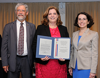 From left, John Holdren, assistant to the President for science and technology, and director of the White House Office of Science and Technology Policy, Elizabeth Parry, coordinator of the Engineering Place at NC State, and France A. Córdova, director of the National Science Foundation. The photo was taken at a White House event June 16, where she was awarded the Presidential Award for Excellence in Science, Mathematics and Engineering Mentoring. Photo credit: National Science Foundation