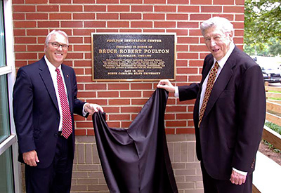 Chancellor Randy Woodson, left, and former Chancellor Poulton at the dedication of the Poulton Innovation Center on Centennial Campus.