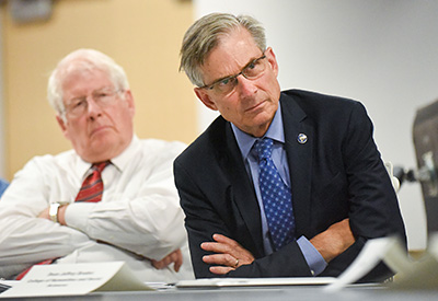 NEH Chairman William Adams (right) and N.C. Rep. David Price discuss the digital humanities at NC State.