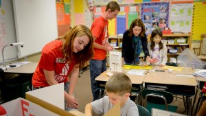 Goodnight scholars work with elementary school students. This year, the Goodnight Scholars fund became the first NC State endowment to reach $100 million.
