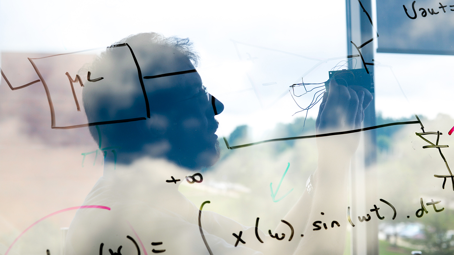 A dreamy double exposure of Alpert Bozkurt and his equations.