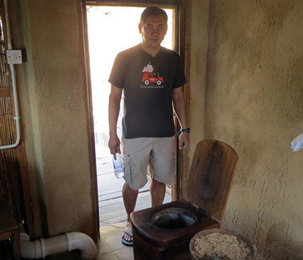 De los Reyes with a composting toilet in Malawi. Photo courtesy of Francis de los Reyes.