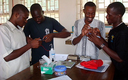 Undergraduate Physics students at Makerere University in Uganda assembling dye-sensitized solar cells using supplies from SciBridge experiment kits. Photo courtesy of Veronica Augustyn.
