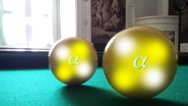 The scattering of two alpha particles is illustrated. This antique English billiards table is located in a late 18th century villa called Villa Tambosi in Trento, which houses the European Centre for Theoretical Studies in Nuclear Physics and Related Areas.