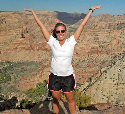 Atkins in front of the San Rafael Swell, Utah. Photo courtesy of Rachel Atkins.