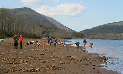 Overview of excavations in southwestern Virginia. Joseph Gingerich in foreground (left), NC State Students and volunteers in background. Photo credit: Kara Koehrn. Click to enlarge.