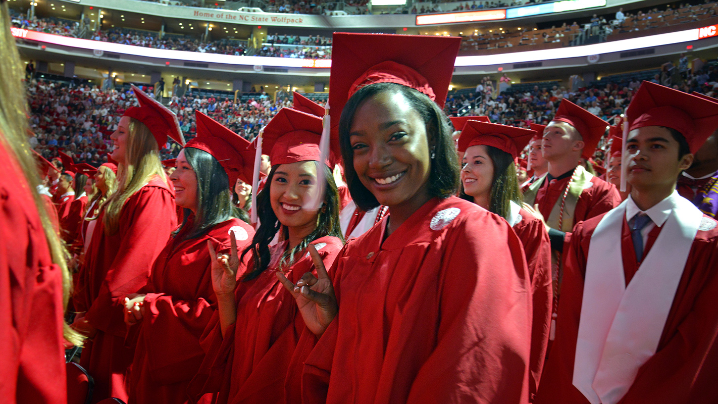 A diverse group of NC State students at graduation.