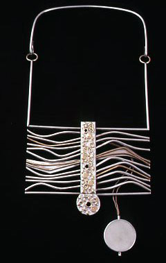 A necklace designed by Scherr that doubles as a heart monitor was featured in a 1980 exhibit at that American Craft Council.