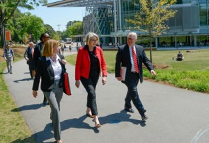 Ms. Spelling, center, walks with NC State Chancellor Randy Woodson, right, and University Architect Lisa Johnson in front of the Talley Student Union while on campus.