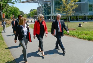 Ms. Spelling, center, walks with NC State Chancellor Randy Woodson, right, and University Architect Lisa Johnson in front of the Talley Student Union while on campus.