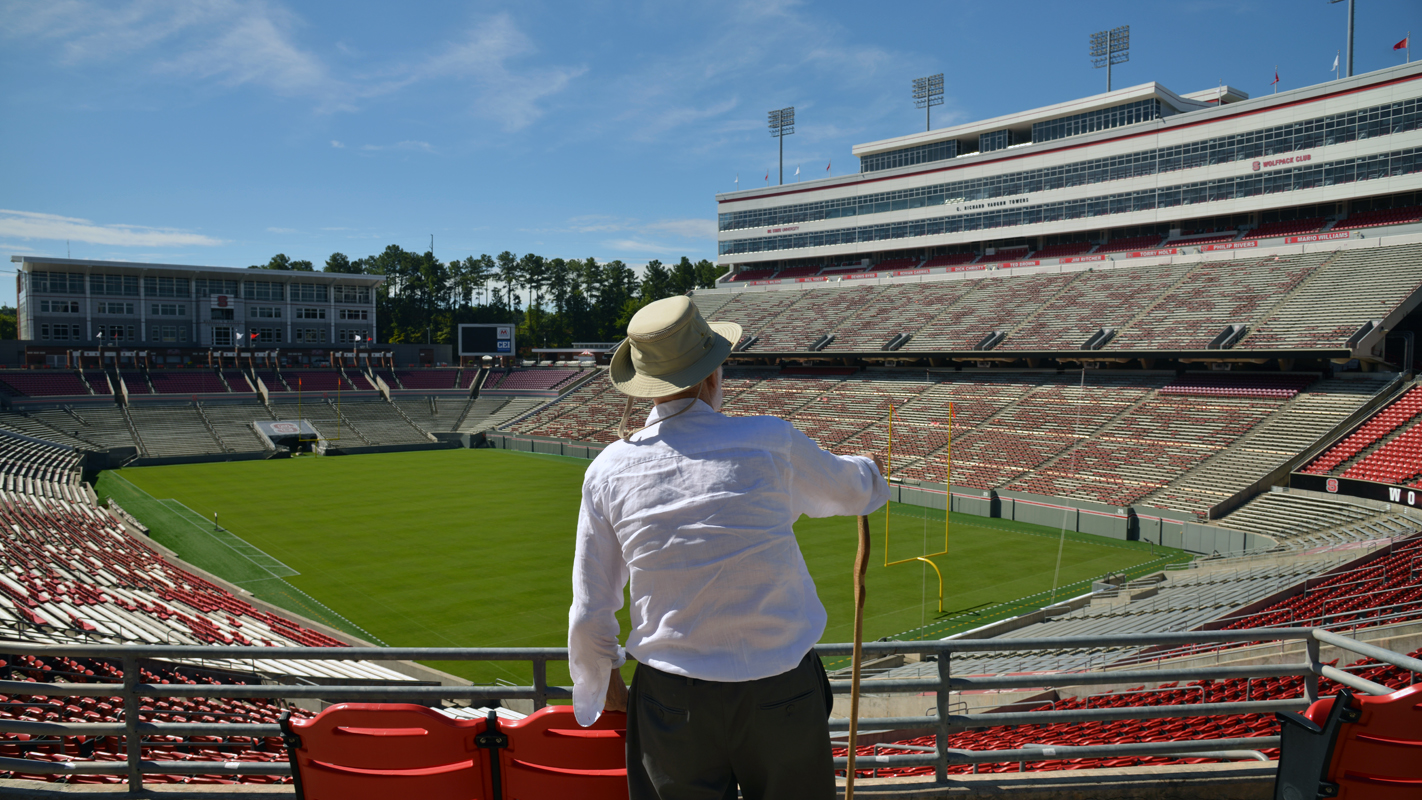 Charles Kahn views the field at Carter-Finley Stadium from the stands.