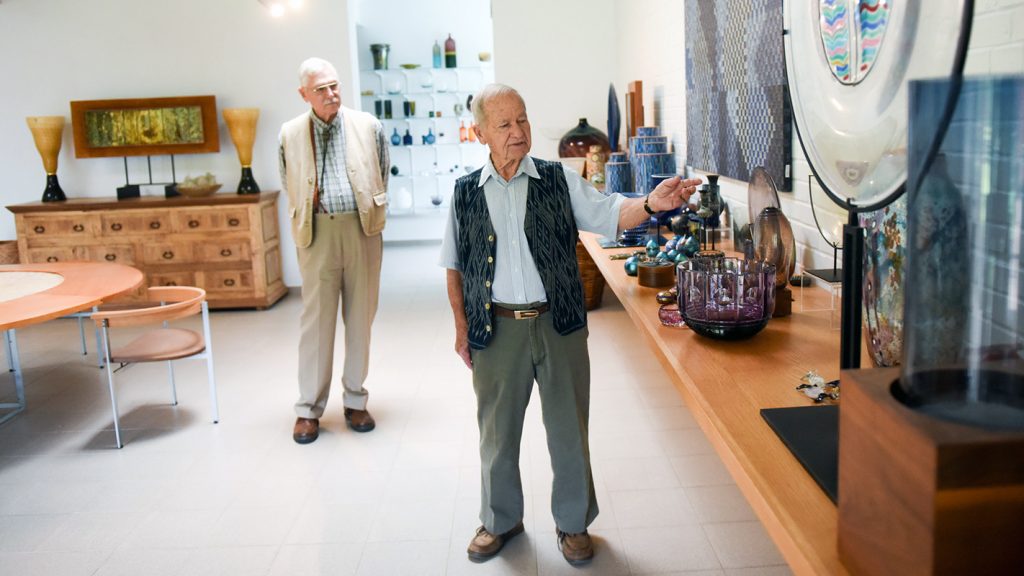 Two older gentlemen giving a tour o