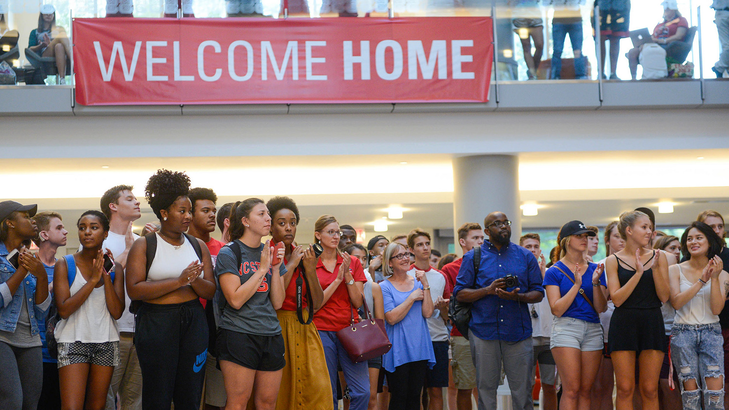 Students gathered under a "Welcome Home" banner at Respect the Pack 2016.