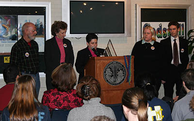 The GLBT Center’s first director, Justine Hollingshead, center, addresses supporters at the grand opening event.