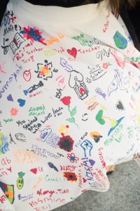 A close-up of Kaitlin Montgomery's skirt, hand-decorated by her students.