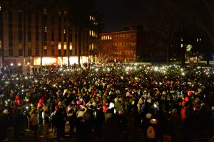 Students congregate for a candlelight vigil for three slain NC State students