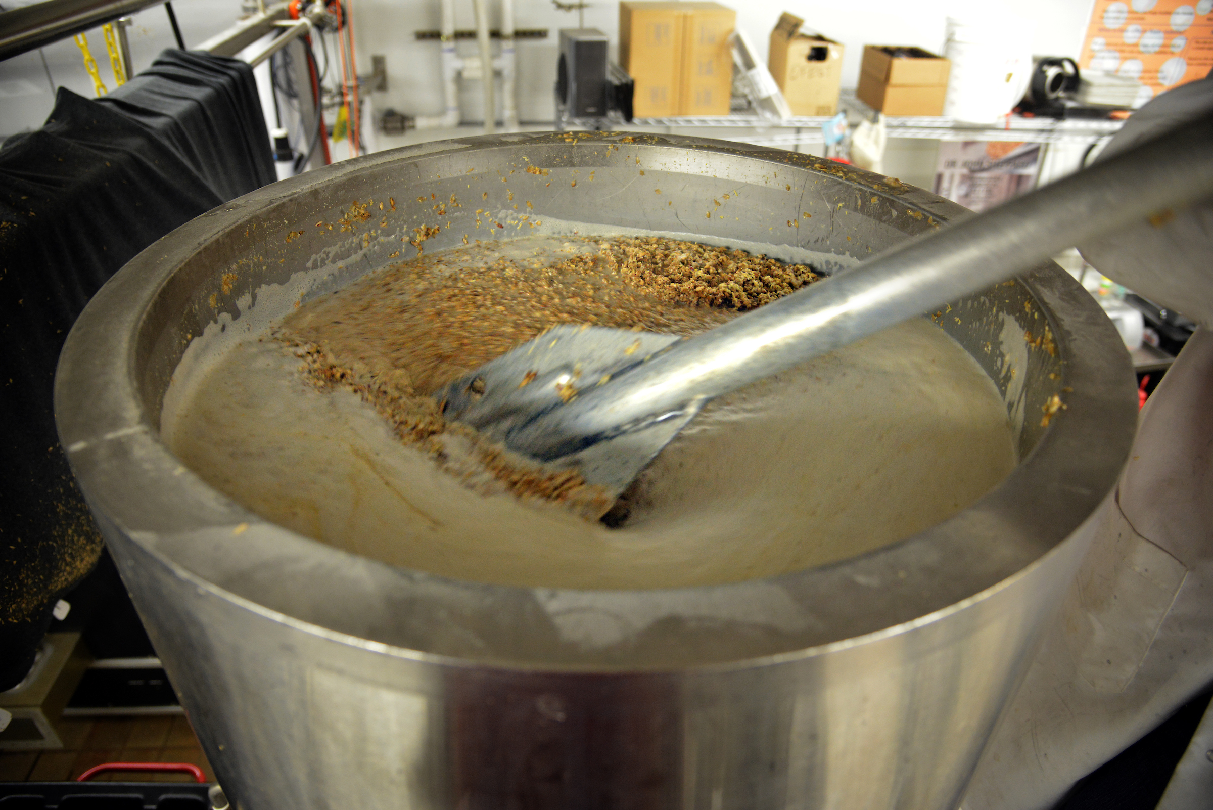 Malt is stirred for a beer production run in a Schaub Hall lab.