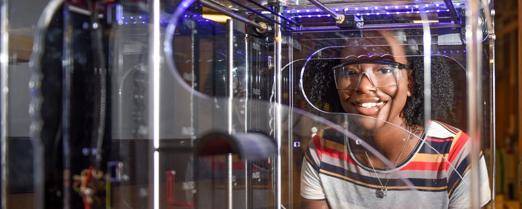 NC State student Niambé James using a 3-D printer at the College of Natural Resources.