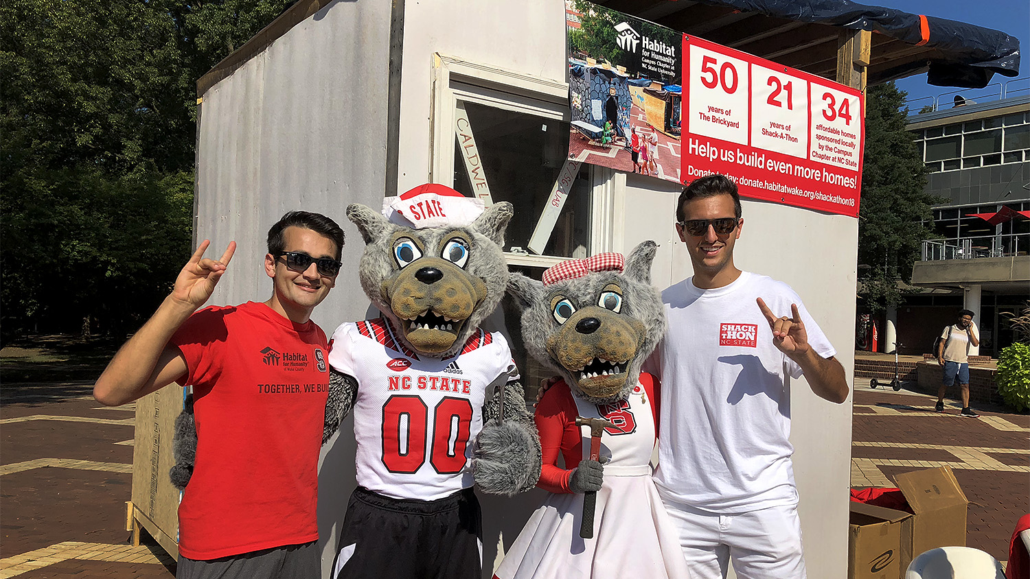 NC State students posing with Mr. and Mrs. Wuf