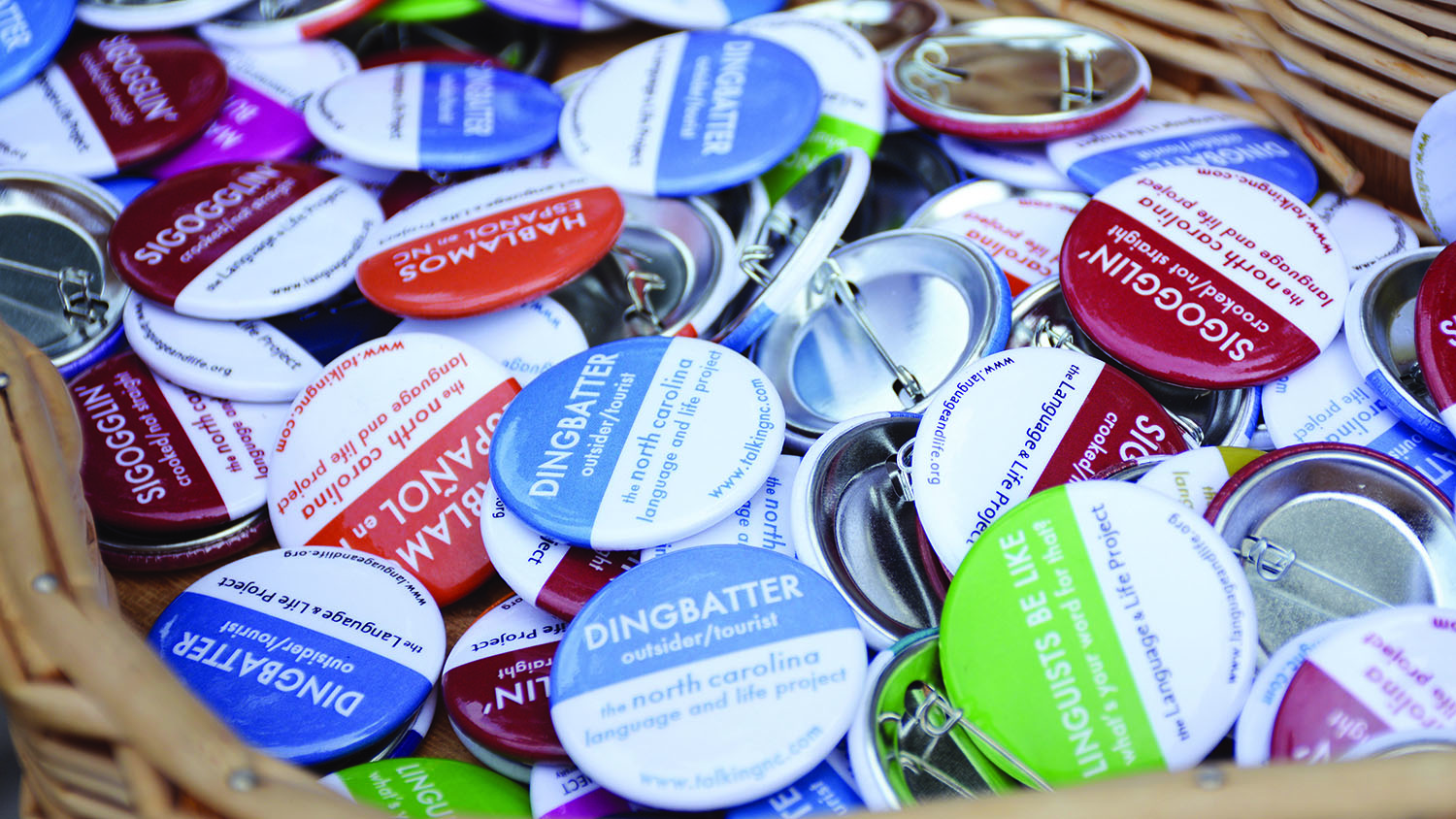 A basket of buttons features North Carolina phrases.