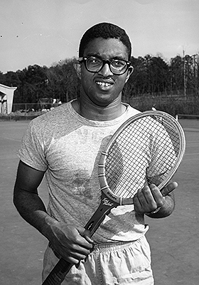 Holmes on tennis court in the 1950s.