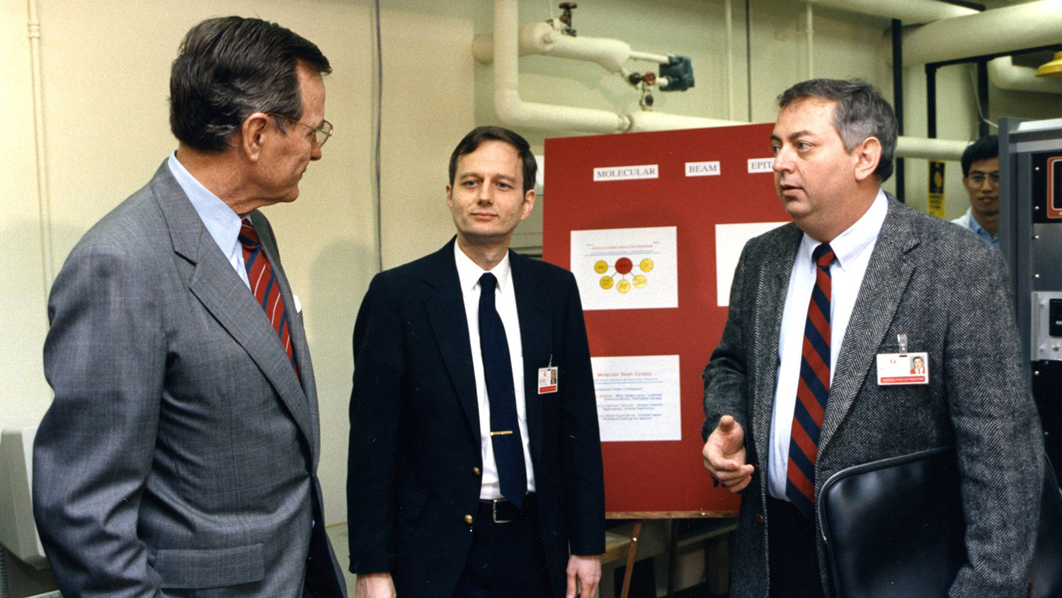 President George H.W. Bush talks with two NC State faculty during a visit to campus in 1990