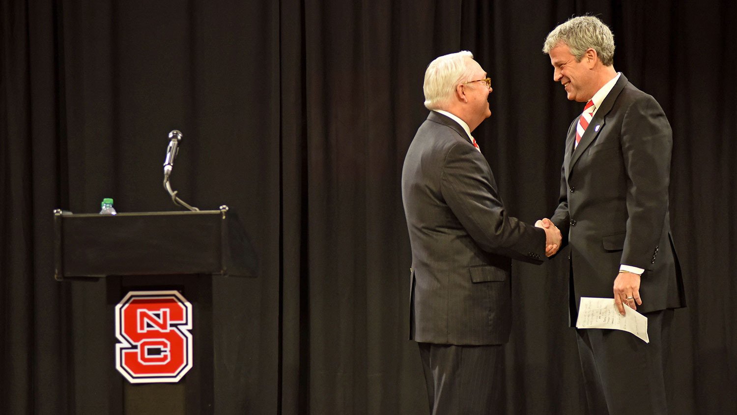 Chancellor Randy Woodson greets Boo Corrigan at Reynolds Coliseum Thursday.