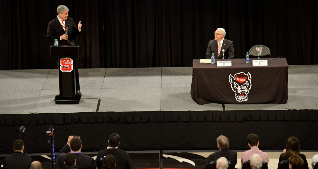 Boo Corrigan and Chancellor Woodson share the stage at Reynolds Coliseum.