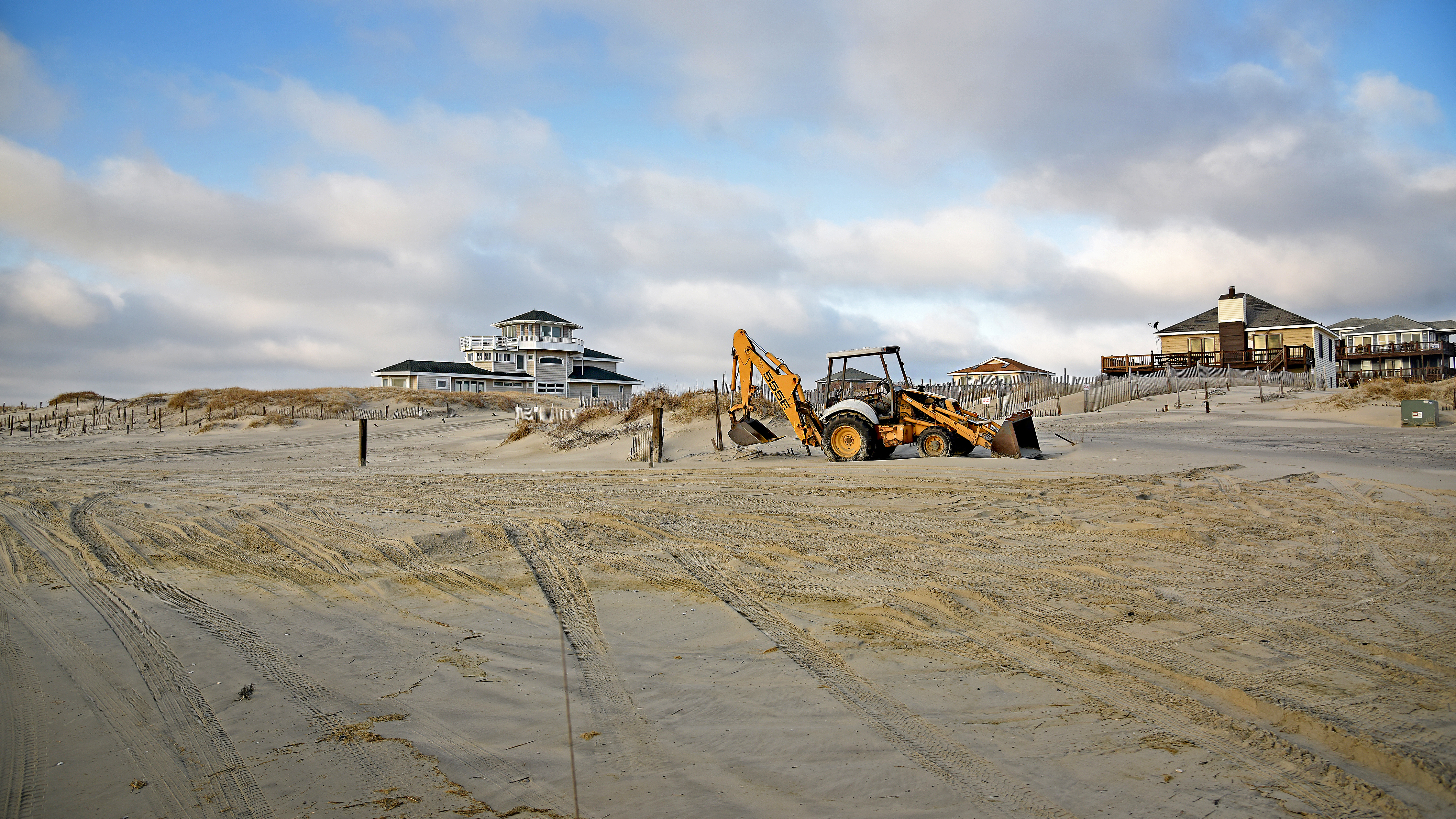 Heavy equipment on the beach to move sand