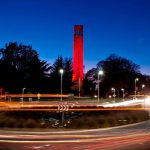 image of the belltower lit red