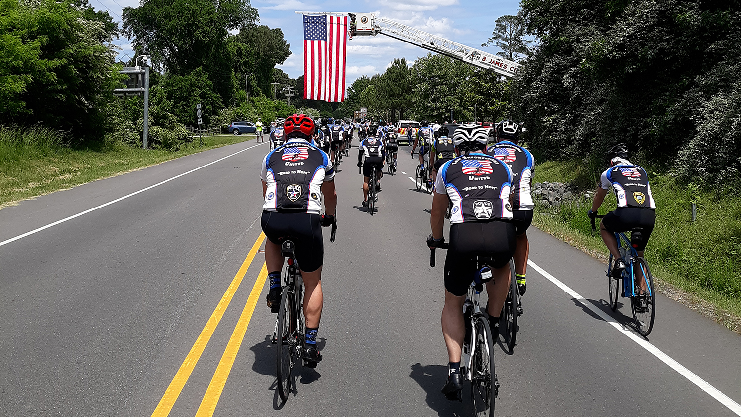 Cyclists from Raleigh approach Jamestown, Virginia.